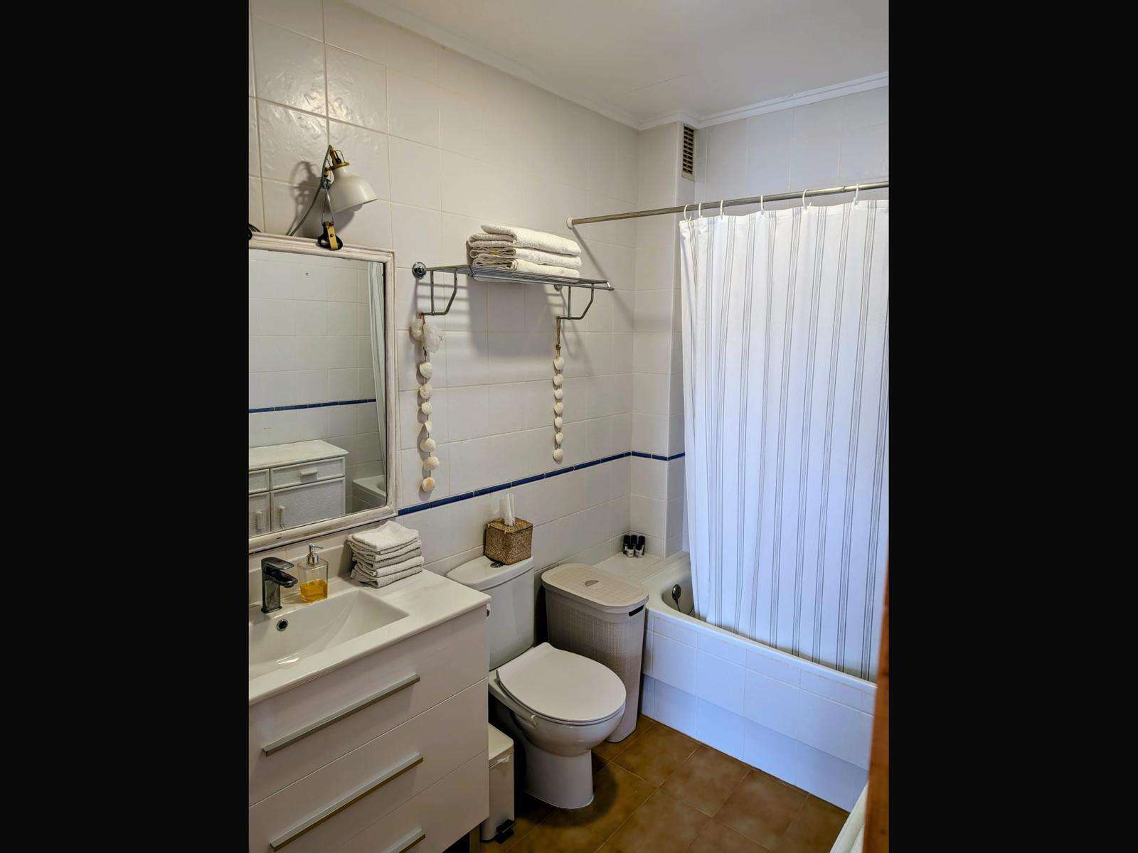 Bathroom with bathtub and shower