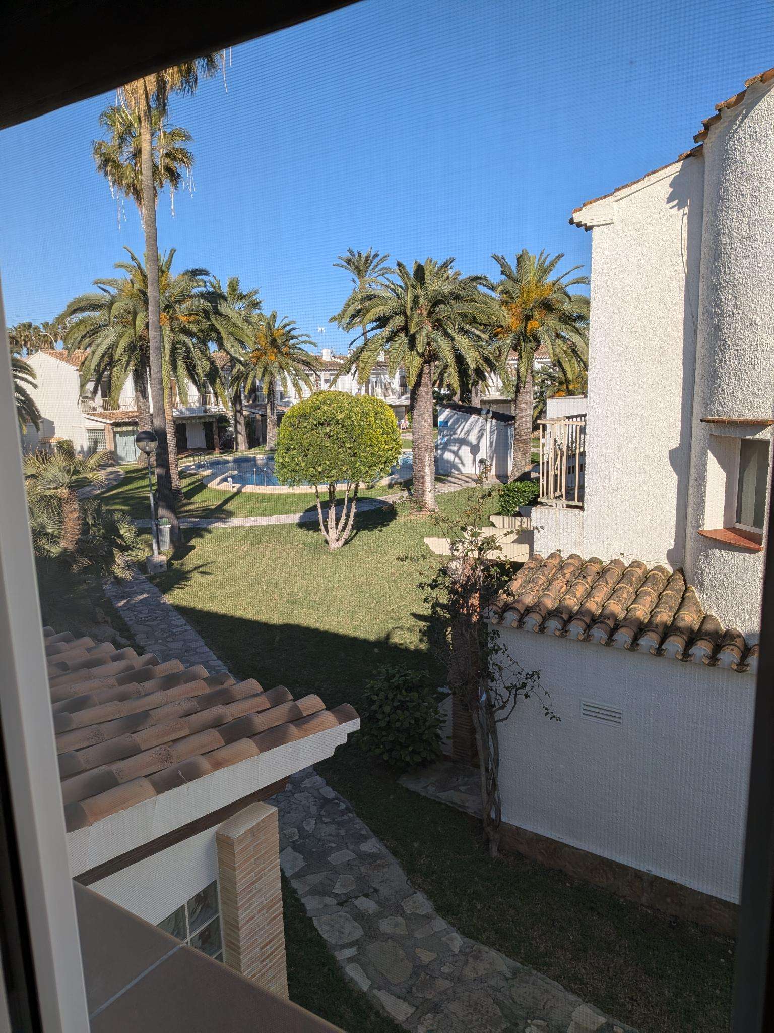 View over the garden and pool from the house