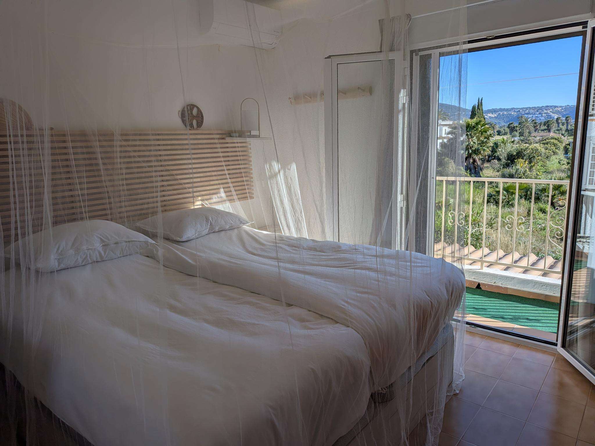 Main bedroom with double bed and French balcony